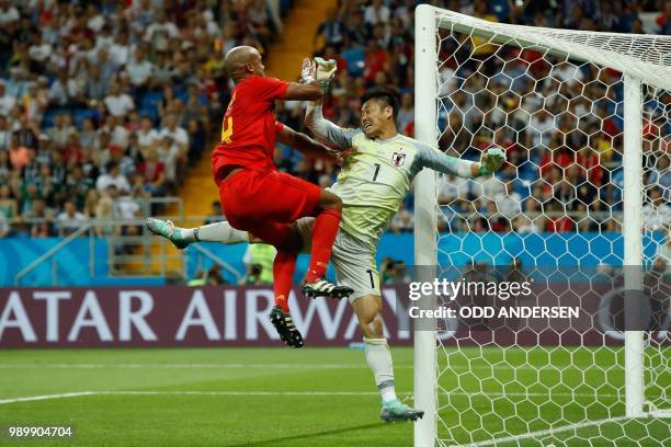 Belgium's defender Vincent Kompany tries to score against Japan's goalkeeper Eiji Kawashima during the Russia 2018 World Cup round of 16 football...