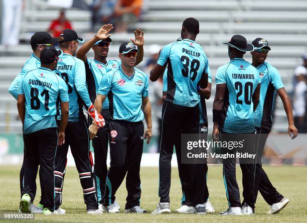 David Warner of Winnipeg Hawks celebrates with teammates after catching out Nizakat Khan of Toronto Nationals during a Global T20 Canada match at...