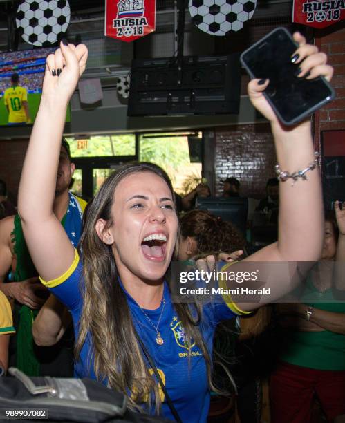Brazil supporter Carla Bastos celebrates Brazil's second goal against Mexico during a FIFA World Cup Round of 16 knockout stage watch party at Vares...