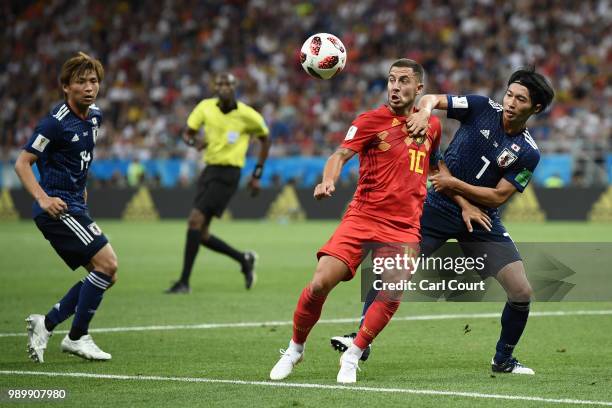 Eden Hazard of Belgium is challenged by Gaku Shibasaki of Japan during the 2018 FIFA World Cup Russia Round of 16 match between Belgium and Japan at...