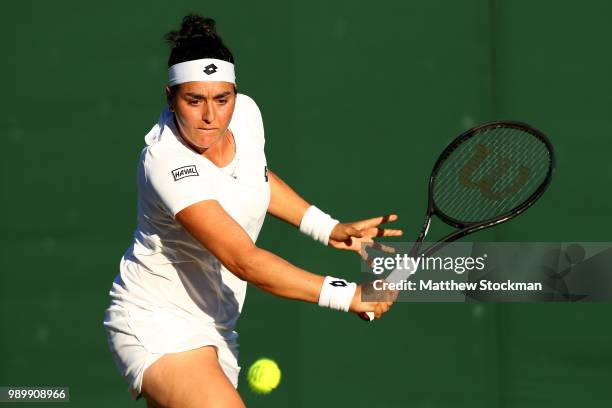 Agnieszka Radwanska of Poland returns against Elena-Gabriela Ruse of Romania on day one of the Wimbledon Lawn Tennis Championships at All England...