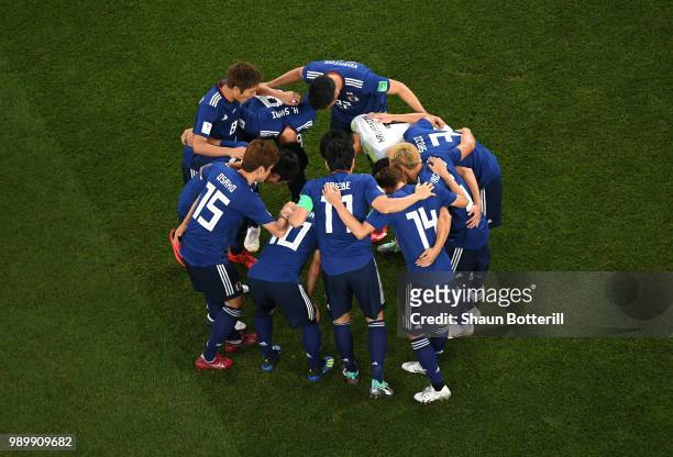 Japan players form a huddle prior to the 2018 FIFA World Cup Russia Round of 16 match between Belgium and Japan at Rostov Arena on July 2, 2018 in...