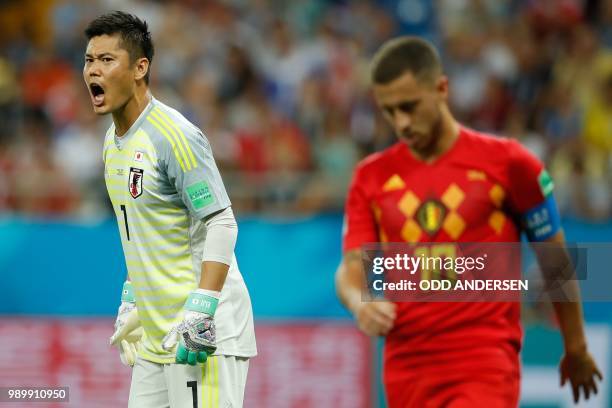 Japan's goalkeeper Eiji Kawashima reacts next to Belgium's forward Eden Hazard during the Russia 2018 World Cup round of 16 football match between...