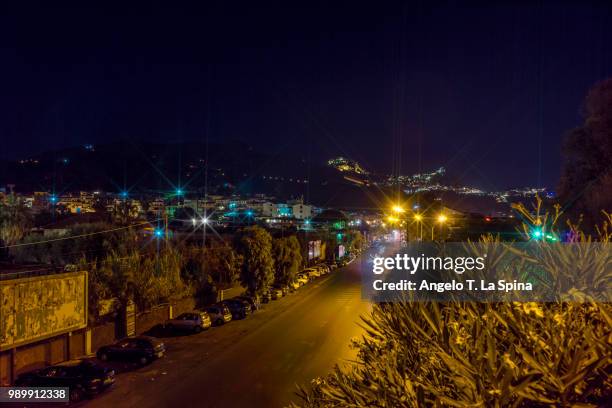 a view to taormina and castelmola by night - castelmola stock pictures, royalty-free photos & images