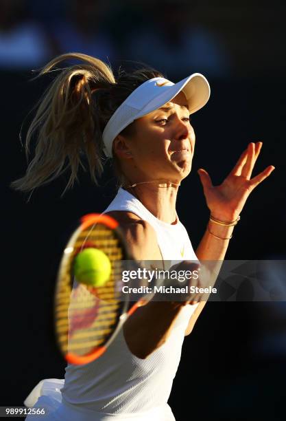 Elina Svitolina of Ukraine returns against Tatjana Maria of Germany during their Ladies' Singles first round match on day one of the Wimbledon Lawn...