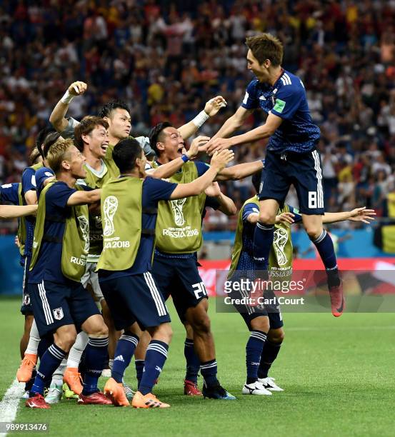 Genki Haraguchi of Japan celebrates with teammates after scoring his team's first goal during the 2018 FIFA World Cup Russia Round of 16 match...