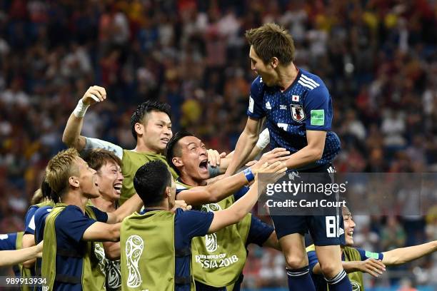Genki Haraguchi of Japan celebrates with teammates after scoring his team's first goal during the 2018 FIFA World Cup Russia Round of 16 match...