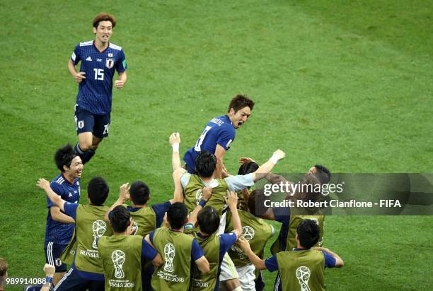 Genki Haraguchi of Japan celebrates with teammates after scoring his team's first goal during the 2018 FIFA World Cup Russia Round of 16 match...