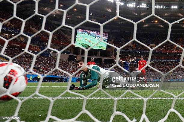 Belgium's goalkeeper Thibaut Courtois fails to stop a goal by Japan's midfielder Takashi Inui during the Russia 2018 World Cup round of 16 football...