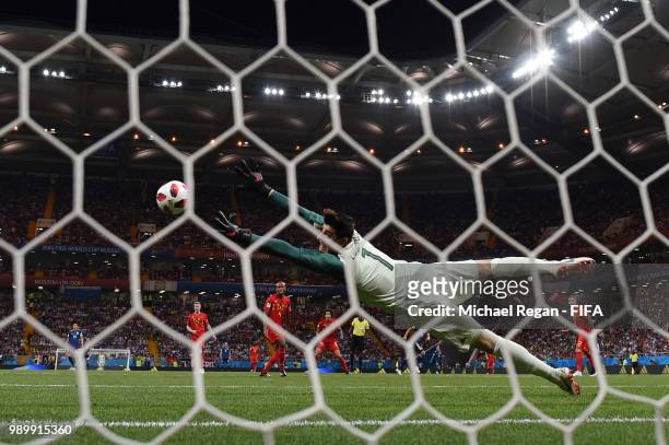 Takashi Inui of Japan scores past Thibaut Courtois of Belgium his team's second goal during the 2018 FIFA World Cup Russia Round of 16 match between...
