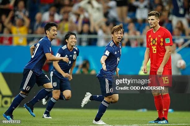 Japan's midfielder Takashi Inui celebrates after scoring during the Russia 2018 World Cup round of 16 football match between Belgium and Japan at the...
