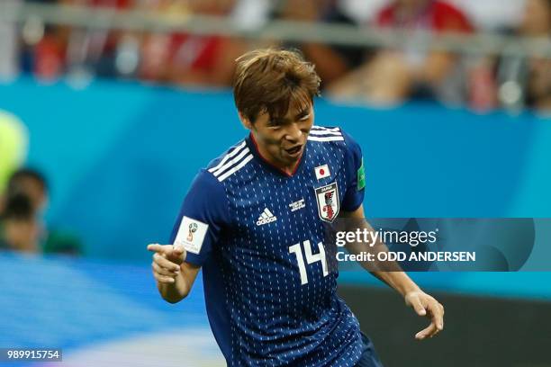 Japan's midfielder Takashi Inui celebrates after scoring during the Russia 2018 World Cup round of 16 football match between Belgium and Japan at the...