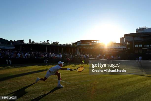 Benjamin Bonzi of France returns a shot to Lukas Lacko of Slovakia on day one of the Wimbledon Lawn Tennis Championships at All England Lawn Tennis...