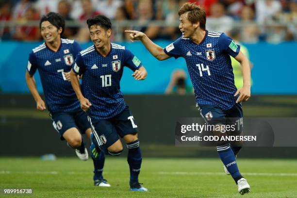 Japan's midfielder Takashi Inui celebrates after scoring during the Russia 2018 World Cup round of 16 football match between Belgium and Japan at the...