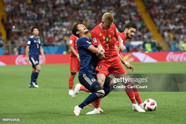 Hiroki Sakai of Japan is tackled by Kevin De Bruyne of Belgium during the 2018 FIFA World Cup Russia Round of 16 match between Belgium and Japan at...