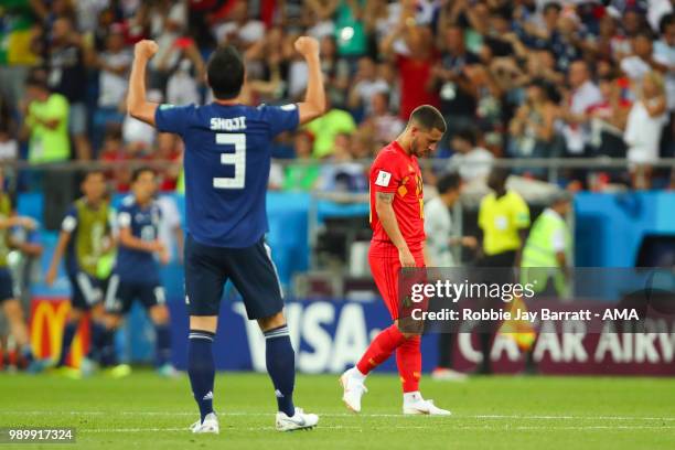 Eden Hazard of Belgium looks dejected as Gen Shoji of Japan celebrates after Takashi Inui of Japan scored a goal to make it 0-2 during the 2018 FIFA...