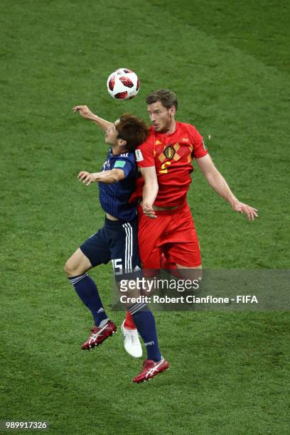 Jan Vertonghen of Belgium wins a header over Yuya Osako of Japan during the 2018 FIFA World Cup Russia Round of 16 match between Belgium and Japan at...