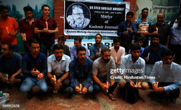 Kashmiri journalists held a candle light vigil in memory of Rising Kashmir Founder and former Editor-in-Chief Shujaat Bukhari, outside Kashmir Press...