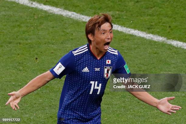 Japan's midfielder Takashi Inui celebrates after scoring his team's second goal during the Russia 2018 World Cup round of 16 football match between...