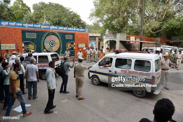 Ambulances carrying mortal remains of 11 members of a Bhatia family who were allegedly found dead inside their house at Burari village, arrives at...