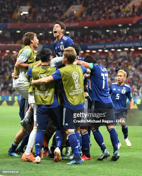 Takashi Inui of Japan celebrates with teammates after scoring his team's second goal during the 2018 FIFA World Cup Russia Round of 16 match between...