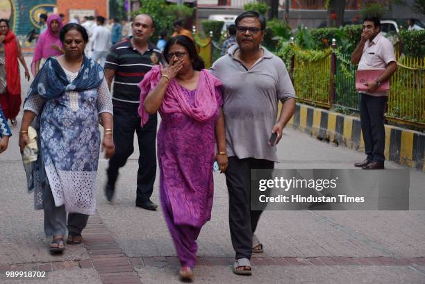 Relatives of the 11 members of the Bhatia family who allegedly committed suicide at their residence in Burari arrive at Nigam Bodh Ghat for the...