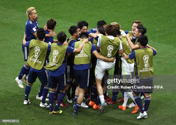 Takashi Inui of Japan celebrates with teammates after scoring his team's second goal during the 2018 FIFA World Cup Russia Round of 16 match between...