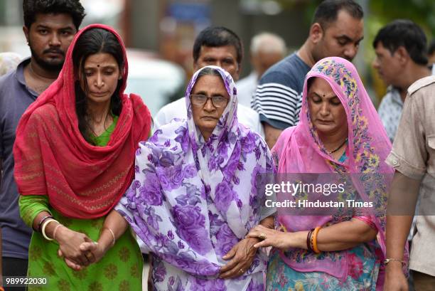 Relatives of the 11 members of the Bhatia family who allegedly committed suicide at their residence in Burari at Nigam Bodh Ghat for the funeral...