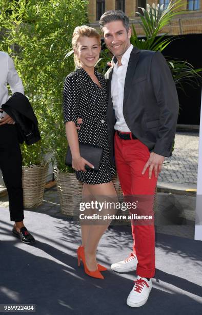 July 2018, Germany, Berlin: Christian Polanc and Iris Marreike Steen arriving to the show by designer Guido Maria Kretschmer. The Spring/Summer 2019...