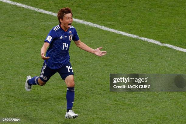 Japan's midfielder Takashi Inui celebrates after scoring his team's second goal during the Russia 2018 World Cup round of 16 football match between...