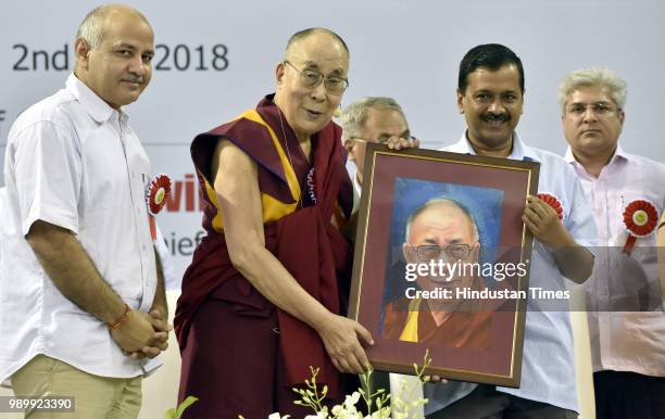 Chief Minister of Delhi, Arvind Kejriwal presents a painting to His Holiness Dalai Lama in the presence of Deputy Chief Minister & Education Minister...