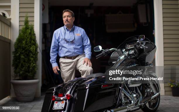 Steve DiMillo poses for a portrait with his Harley-Davidson 2017 Road Glide at his home in Portland. DiMillo has owned Harley-Davidson bikes for 35...