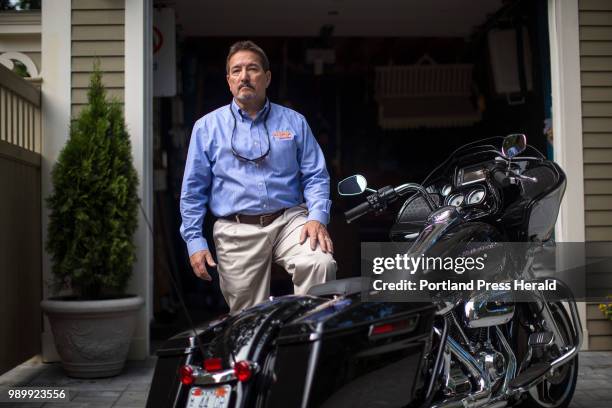 Steve DiMillo poses for a portrait with his Harley-Davidson 2017 Road Glide at his home in Portland. DiMillo has owned Harley-Davidson bikes for 35...