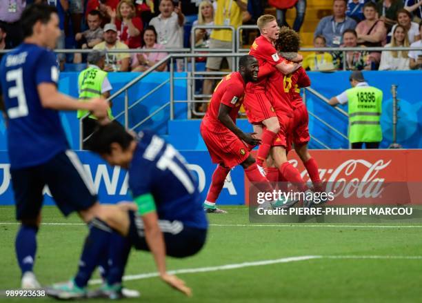 Belgium's midfielder Marouane Fellaini celebrates with Belgium's midfielder Kevin De Bruyne and Belgium's forward Romelu Lukaku after scoring their...