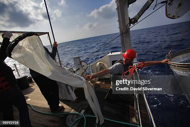 Israeli researchers release nets to gather plankton from the deck of EcoOcean's marine research vessel Mediterranean Explorer on May 11, 2010 in the...