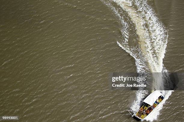 Crab boat is moves in the water in the southwest region of Louisiana as the government tries to protect the coastline from the massive oil spill on...