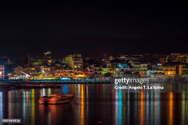 partial view of giardini naxos by night - giardini stock pictures, royalty-free photos & images