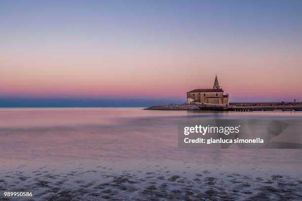 sunset in caorle - caorle stock-fotos und bilder