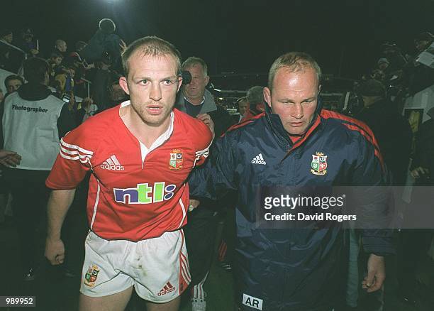 Matt Dawson who scored the winning points for the British and Irish Lions with assitant coach Andy Robinson after the match between the British and...