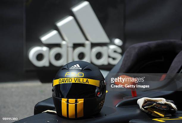 Racing helmet shows the name of Spanish football player David Villa at the Circuiit de Catalunya, scene of the adidas F50 adiZero football boot...