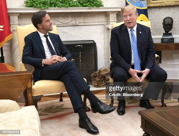 President Donald Trump, right, speaks as Mark Rutte, Netherland's prime minister, listens during a meeting at the White House in Washington, D.C.,...