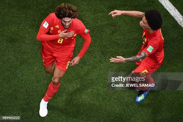 Belgium's midfielder Marouane Fellaini celebrates with Belgium's midfielder Axel Witsel after scoring his team's second goal during the Russia 2018...