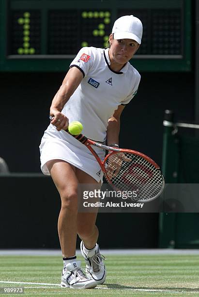 Justine Henin of Belgium on her way to straight sets victory over Conchita Martinez of Spain during the women's quarter finals of The All England...