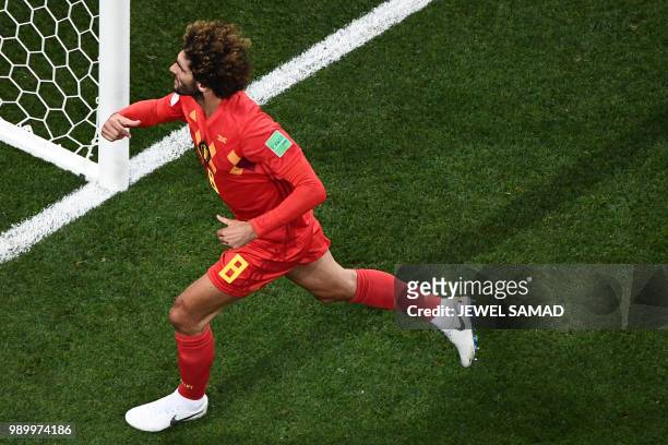Belgium's midfielder Marouane Fellaini celebrates after scoring his team's second goal during the Russia 2018 World Cup round of 16 football match...