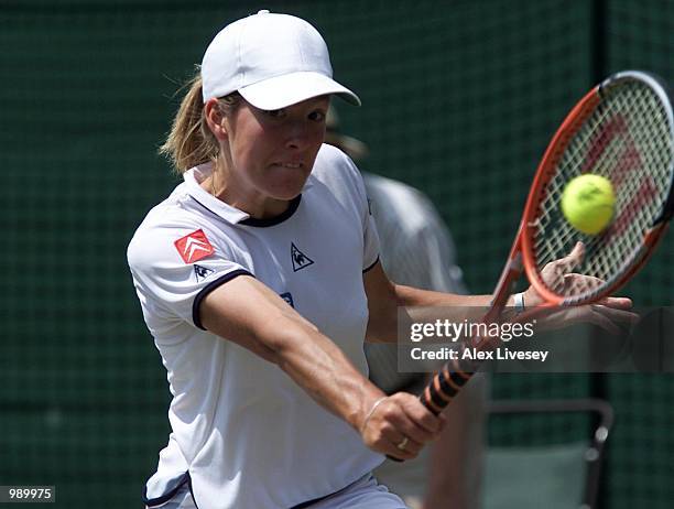 Justine Henin of Belgium on her way to straight sets victory over Conchita Martinez of Spain during the women's quarter finals of The All England...