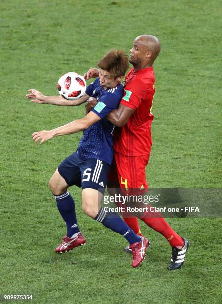 Yuya Osako of Japan is challenged by Vincent Kompany of Belgium during the 2018 FIFA World Cup Russia Round of 16 match between Belgium and Japan at...