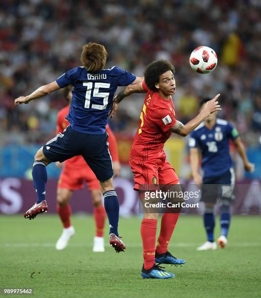 Yuya Osako of Japan competes for a header with Axel Witsel of Belgium during the 2018 FIFA World Cup Russia Round of 16 match between Belgium and...
