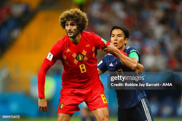 Marouane Fellaini of Belgium competes with Makoto Hasebe of Japan during the 2018 FIFA World Cup Russia Round of 16 match between Belgium and Japan...