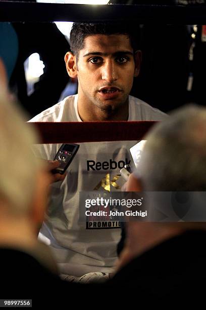 Amir Khan talks to the media at The Trinity Boxing Club NYC ahead of his WBA title fight against Paulie Malignaggi at Madison Square Garden on May...