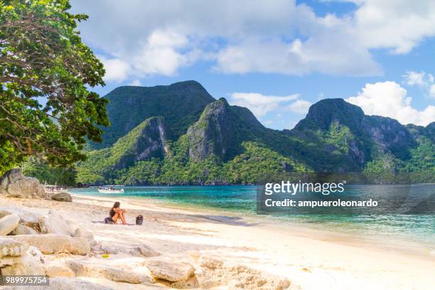 female tourist enjoying her vacations in el nido, philippines - nido stock pictures, royalty-free photos & images